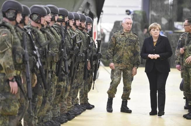 C:\Users\Dell\Documents\german-chancellor-angela-merkel-meets-members-of-4th-company-rapid-action-force-medical-service-ses-of-the-german-armed-forces-bundeswehr-at-an-army-barracks-in-leer-ostfriesland-germany-december-7-2015-reuters-fabian-bi.jpg